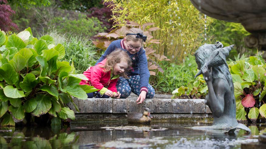 Two kids playing at the pond at Belvedere House and Gardens in Mullingar, County Westmeath