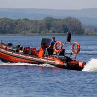 An boat and skipper on a lake