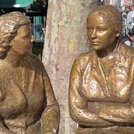 Friendly Tour Guide at the bronze Meeting Place Statue of a woman