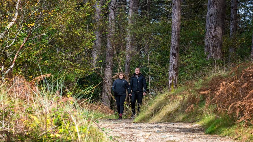 Couple walking Ards Forest Park, Co Donegal