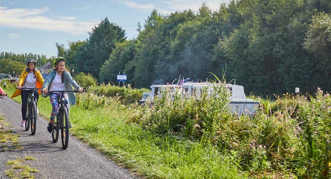A family of four cycling along the Barrow Blueway in Vicarstown, County Laois