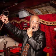 A bus tour guide giving a ghost tour on a bus