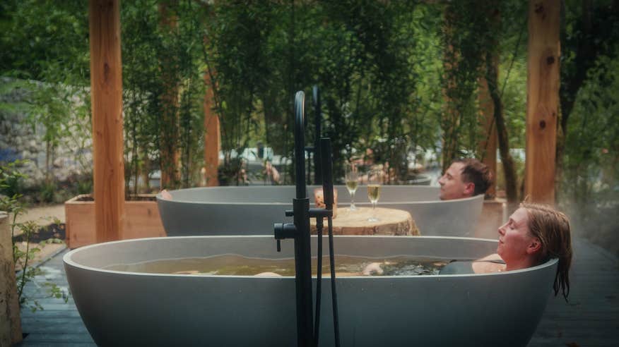 Friends enjoying a soak in seaweed baths at Drumhierny Woodland Hideaway in Leitrim.