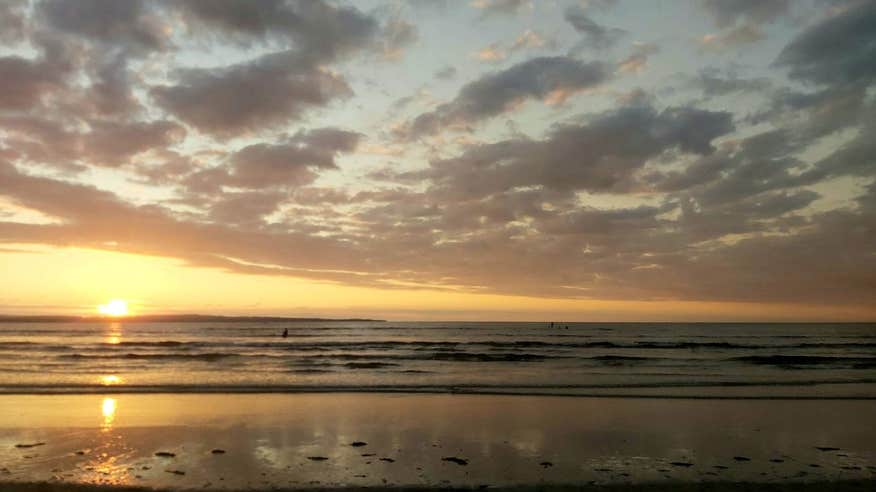 Sunset over the water at Enniscrone Beach in Sligo.