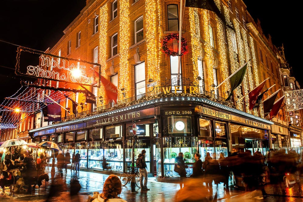 Christmas lights strung up on Wicklow Street in Dublin City at night.