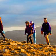 Four people hiking in Wicklow mountains on a Hilltop Treks tour