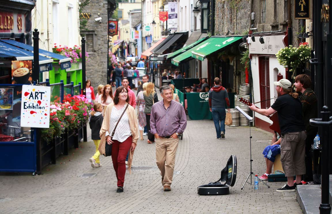 Couple walking down lively streets in Kilkenny City
