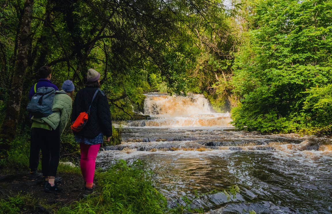 People hiking at Fowley's Falls in Co Leitrim