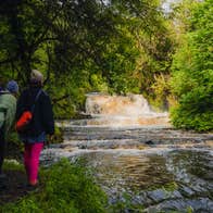 People hiking at Fowley's Falls in Co Leitrim