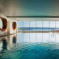 Indoor infinity edge swimming pool at The Well by the Sea Spa at the Cliff House Hotel