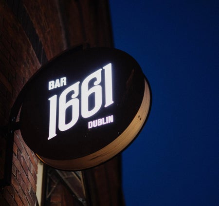 A sign on the wall of BAR 1661