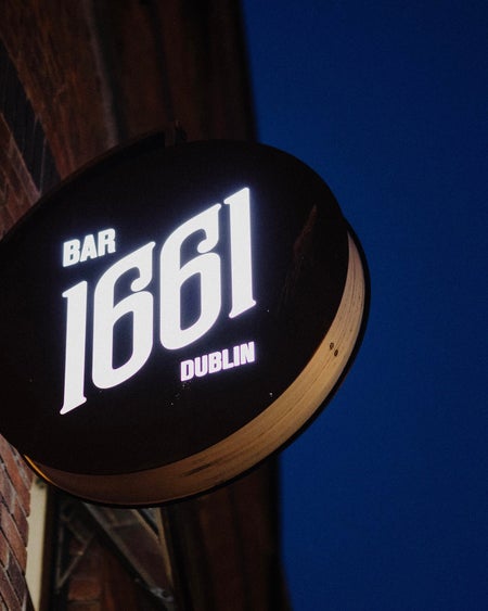 A sign on the wall of BAR 1661