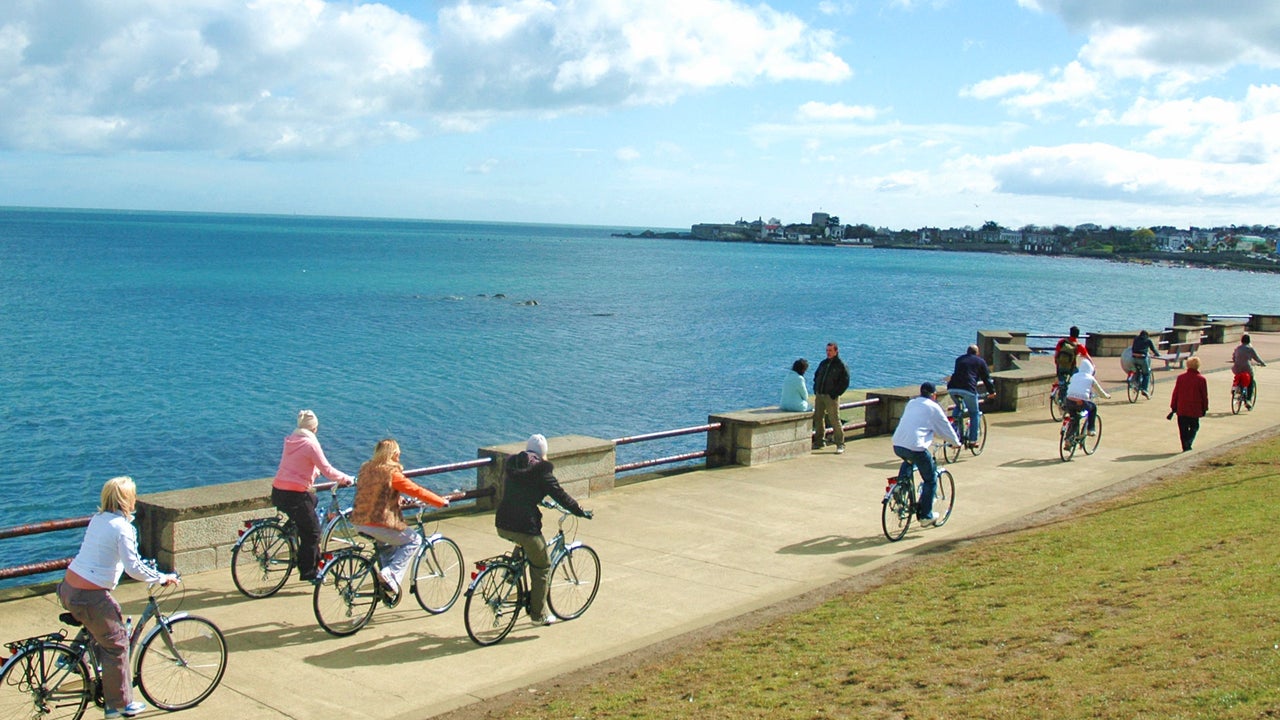 Irish Cycling Safaris cyclist on a path along the coast of Dublin Bay