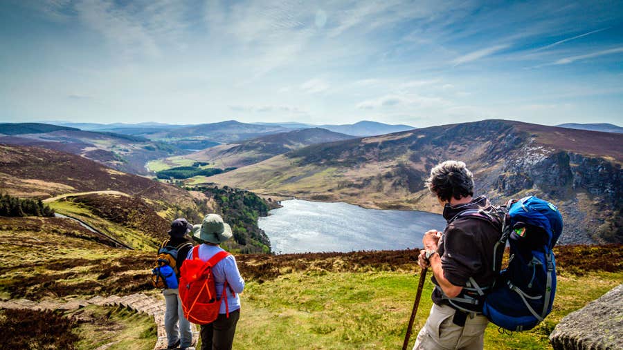 Hikers enjoying a view of Lough Tay from above