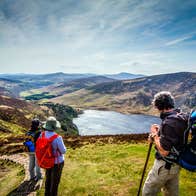 Hikers enjoying a view of Lough Tay from above