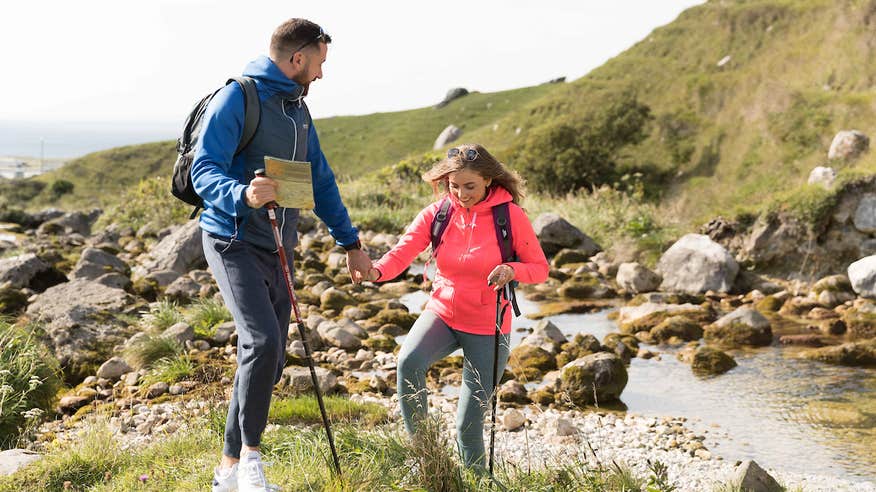 A couple hiking the Caher Valley Loop in Fanore, County Clare.