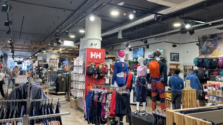 Shop floor with mannequins and clothes on hangers