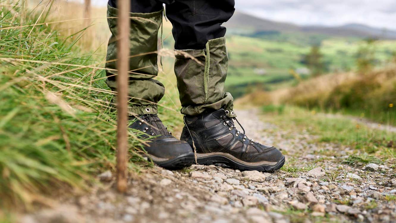 Hiking boots and a stick