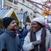 Couple laughing outside a chalet at Winterval.