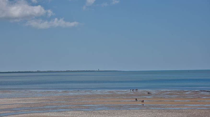 People walking on the strand at Duncannon Beach, Wexford