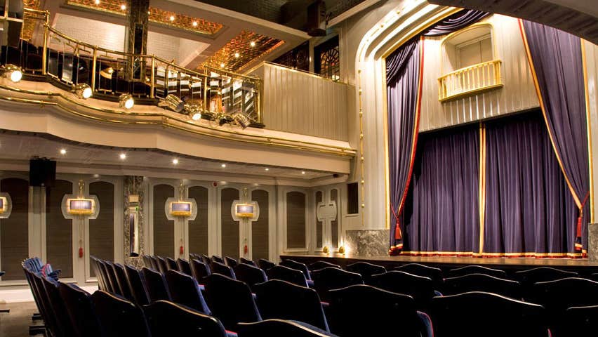 The stage and curtain of the set theatre from downstairs audience perspective and from the side