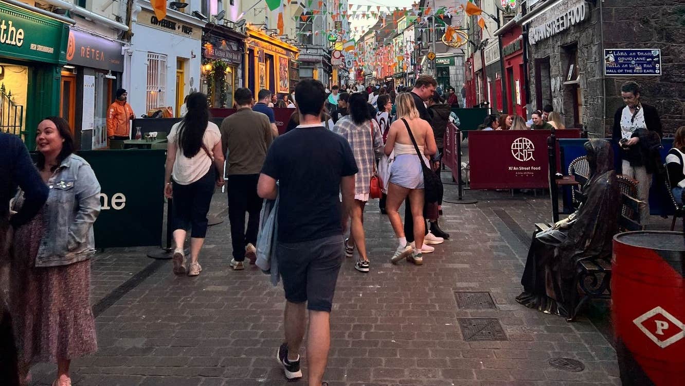 People walking down a busy city street