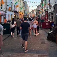 People walking down a busy city street