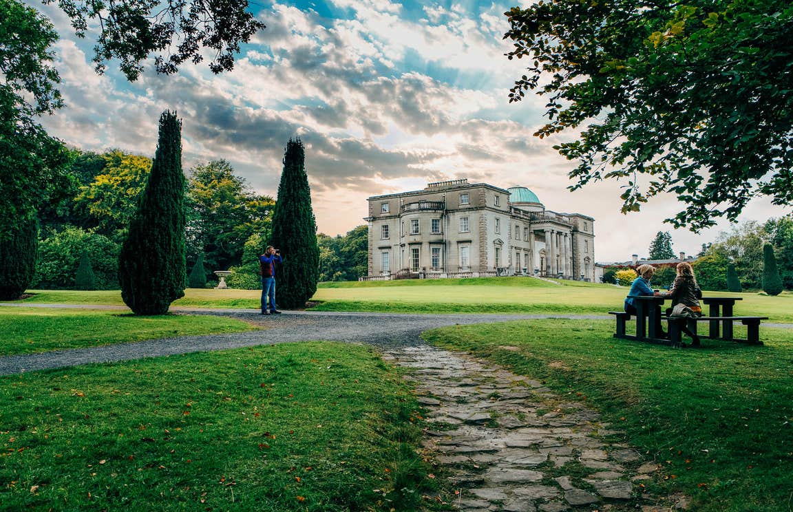 Large gardens and people sitting at a table at Emo Court County Laois