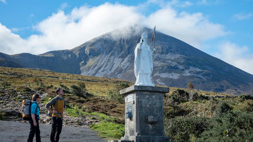 Hikers at the St Patrick statue on Croagh Patrick in Co Mayo