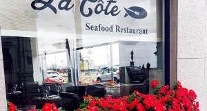 Restaurant window with red flowers
