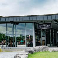 A view of the Doolin Cave Visitor Centre from their garden with colourful flowers