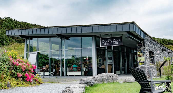 A view of the Doolin Cave Visitor Centre from their garden with colourful flowers