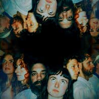 A line of headshots of people reflected above them upside down.