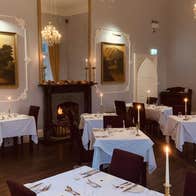 An empty dining area with prepared tables ready for diners