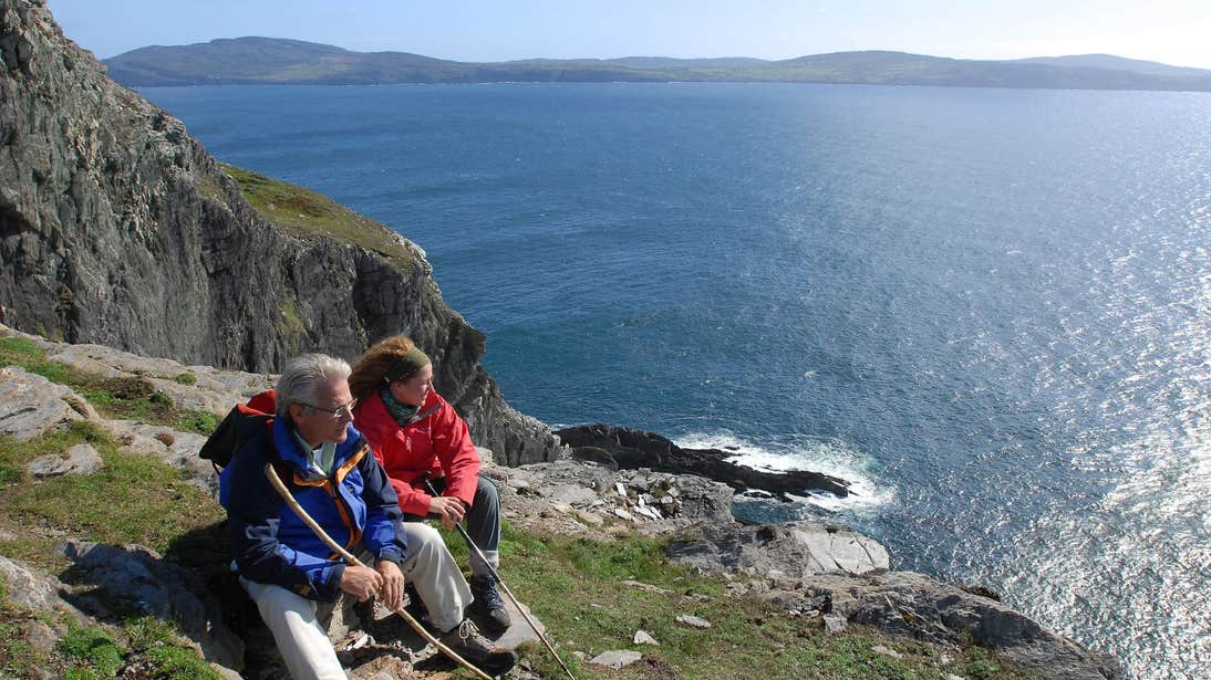 People taking a rest beside the sea on Sheep's Head, County Cork