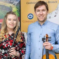 Jason and Lorna McGuinness with musical instruments