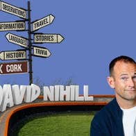 David Nihill: Taking Tangents. A man with rye smile next to a sign post with many signs pointing in various directions.