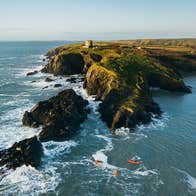 Aerial view of people kayaking along Hook Peninsula in Co Wexford