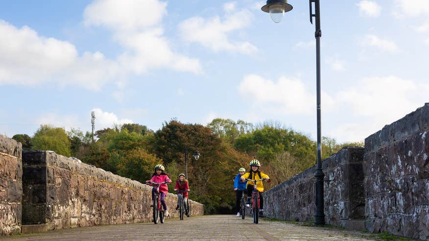 A family cycling the Great Western Greenway in Co Mayo