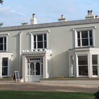 The exterior of Airfield House on the grounds of Airfield Estate