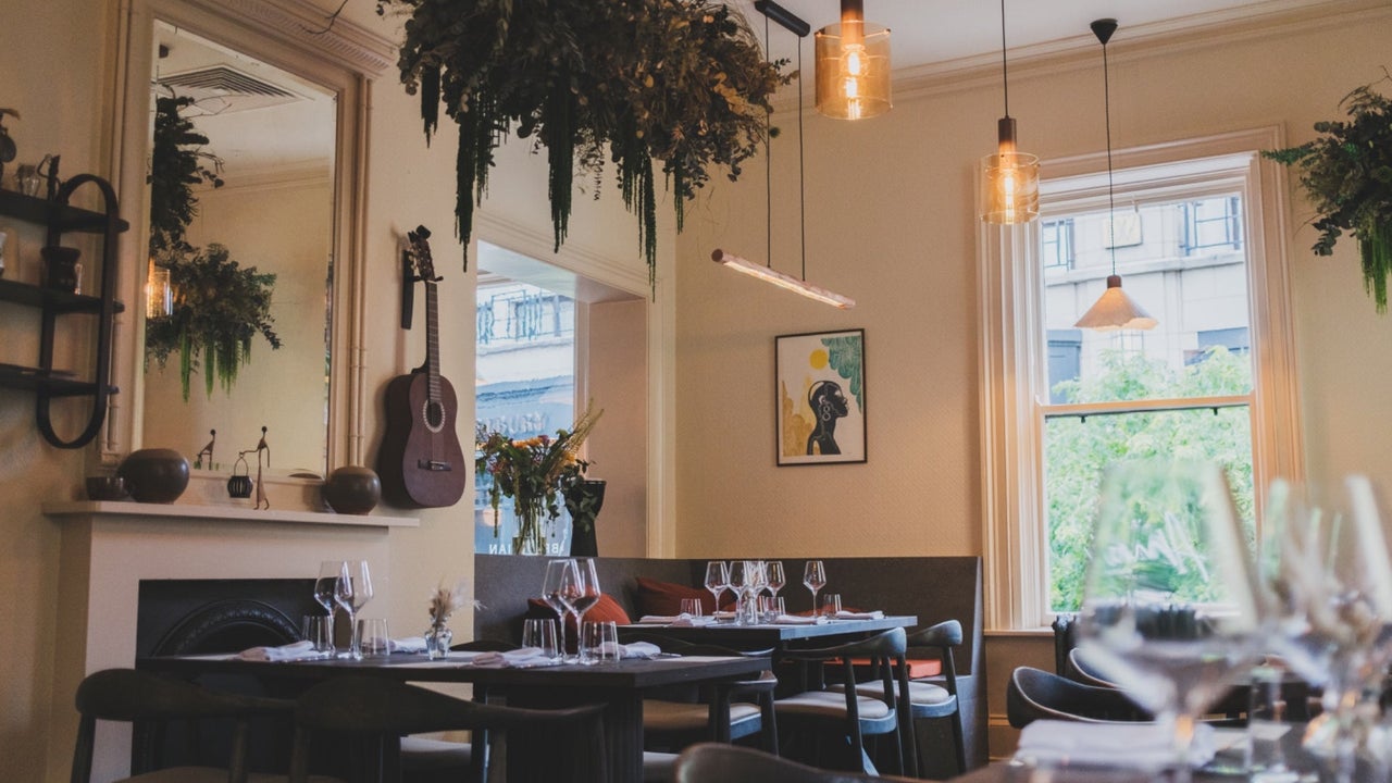 Seating and tables set for dining at Amai By Viktor