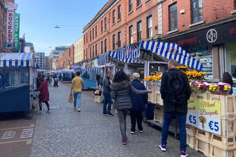 People walking around Moore Street Market in Dublin City centre