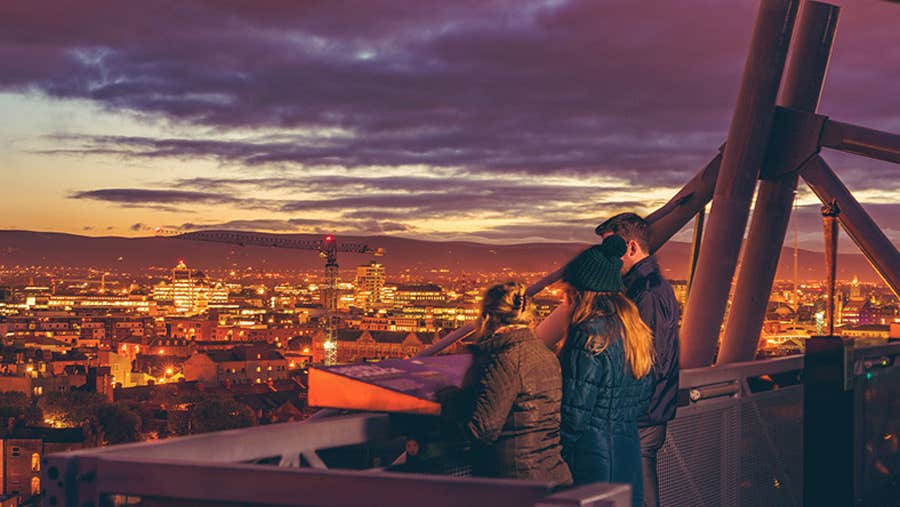 A group on the dusk tour at Croke Park over looking Dublin city