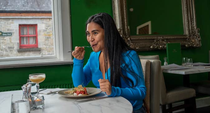 A woman eating at the Redbank Restaurant in Co Leitrim