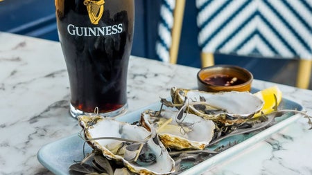 A plate of oysters with a pint of Guinness