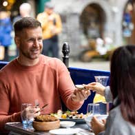 A couple eating food in Galway city