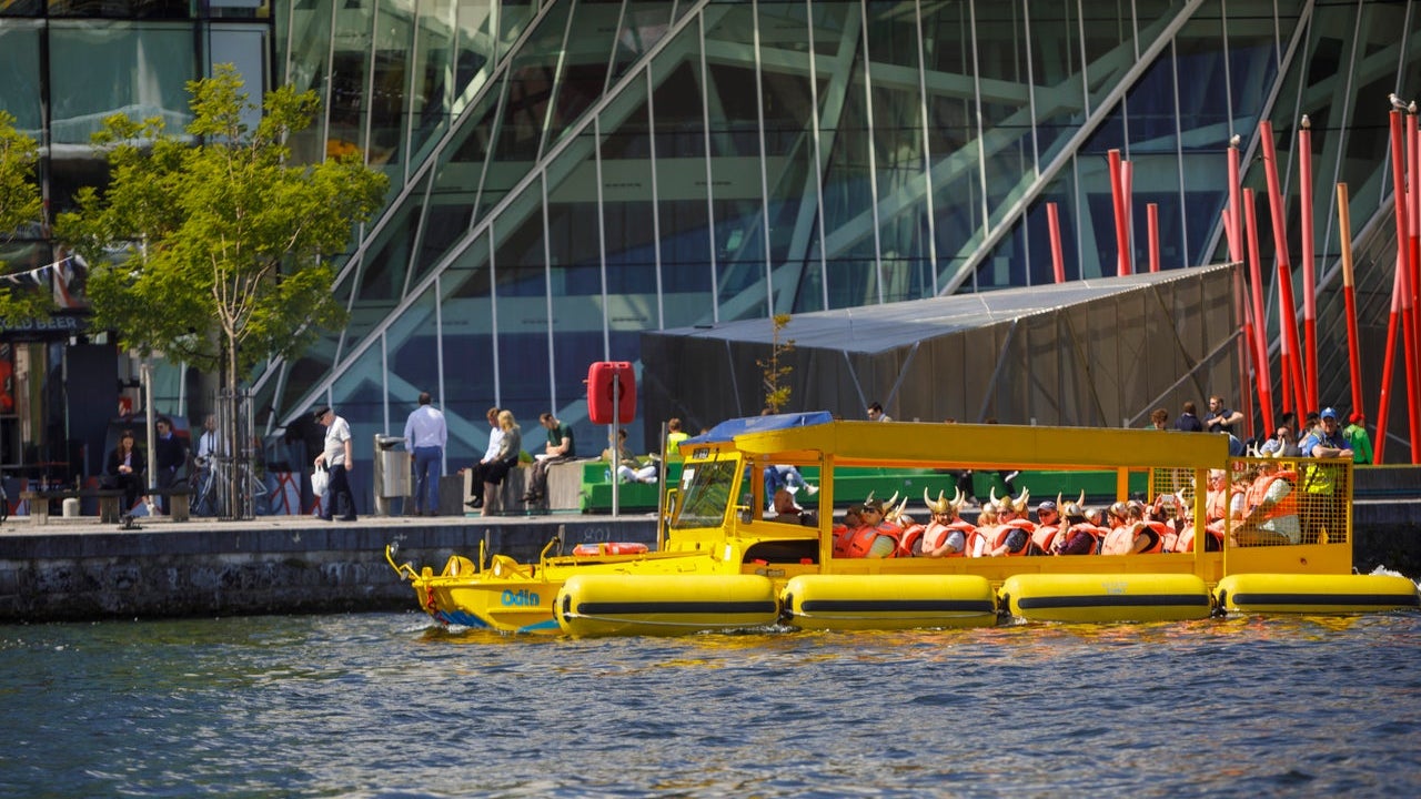 A passenger boat moored at a pier