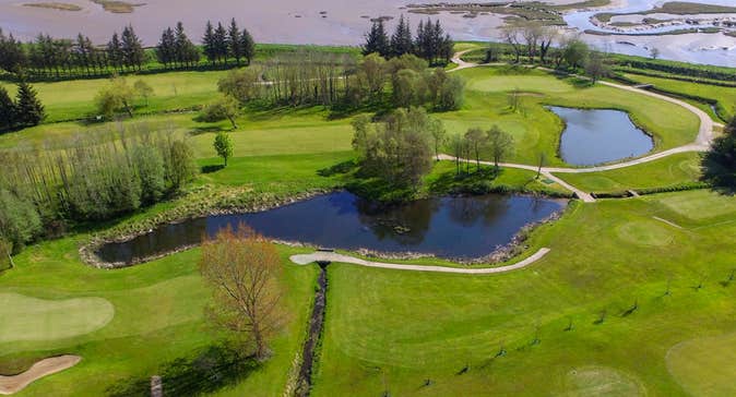 Letterkenny Golf Club aerial view of a green showing water features and Lough Swilly in the background