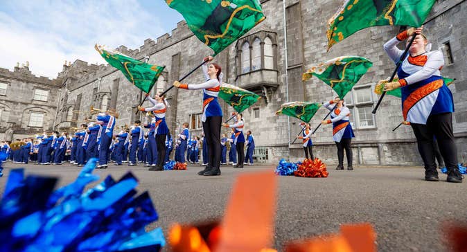 American Marching Band throw flags as part of a performance outside Kilkenny Castle.