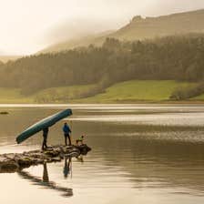 Image of a couple with their dog on Glencar Lake in County Leitrim